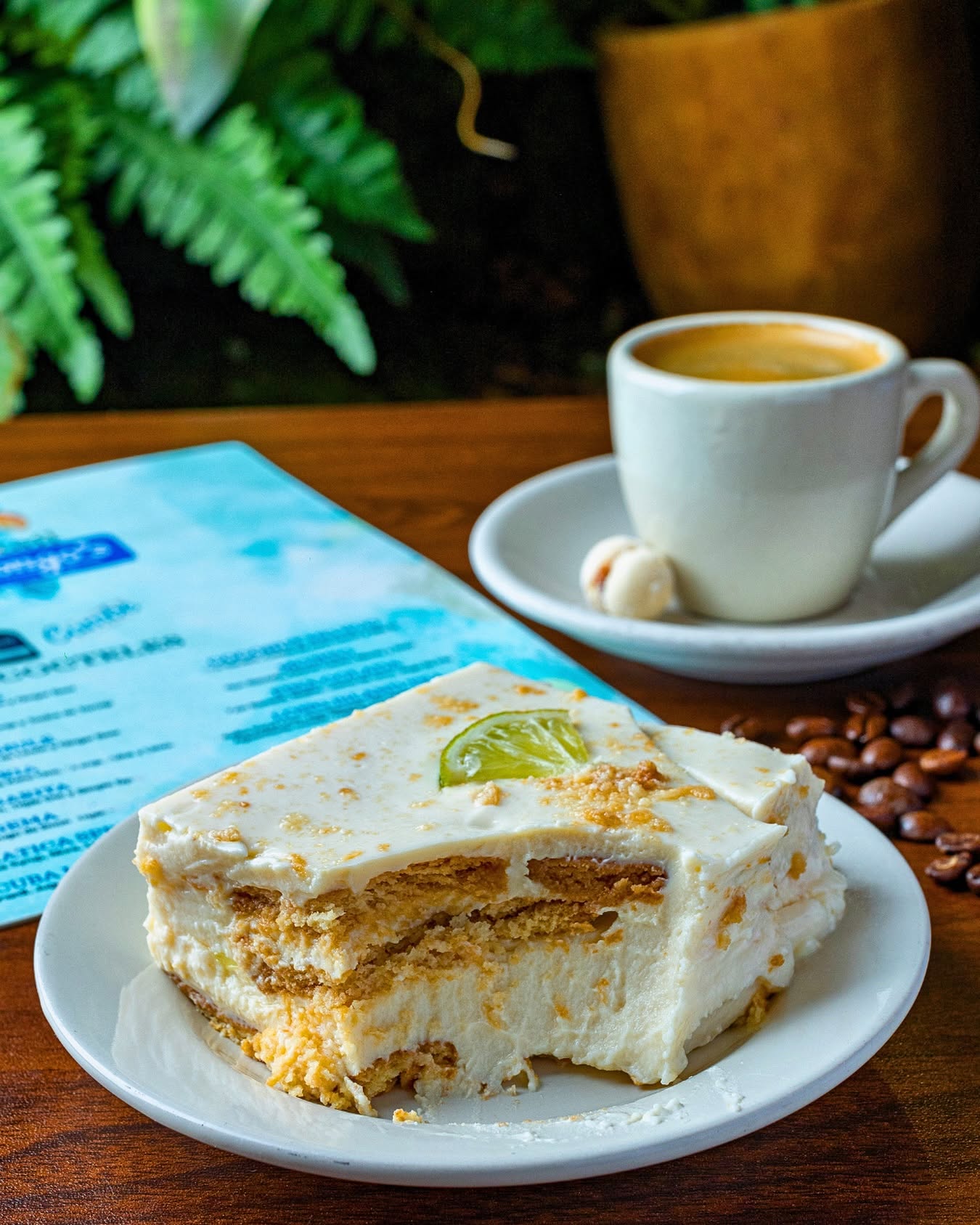 Slice of Colombian lime icebox cake with a shot of Colombian coffee